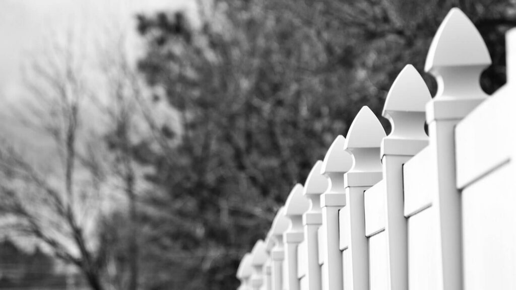 When a Leaning Fence Is a Property-Line Problem, Not Just a Spring Repair
